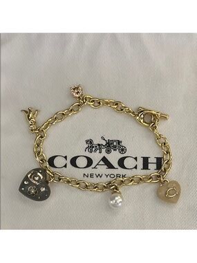 Coach Gold-Tone Charm Bracelet with Black Heart, Gold Heart & Pearl